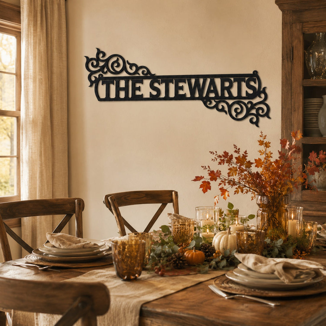 Personalized decorative scroll family name metal sign above a warm Thanksgiving dining table