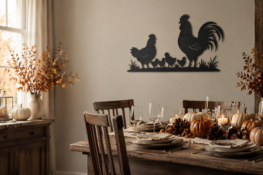 Matte black rooster, hen and chicks metal wall art above a warm Thanksgiving dining table
