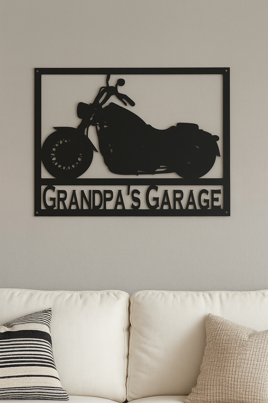 Decorative metal sign with motorcycle design and 'Grandpa's Garage' text on a wall above a sofa.
