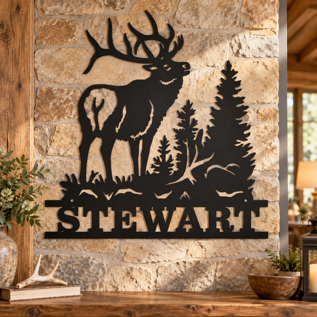 Matte Black personalized STEWART bull elk family name metal sign on a rustic stone cabin wall