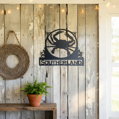 Metal crab sign on porch wall