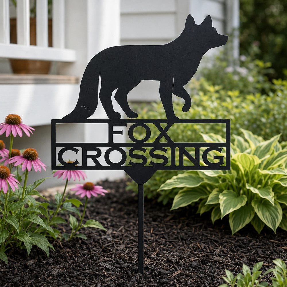 Fox Crossing wildlife garden stake displayed among plants beside a walkway