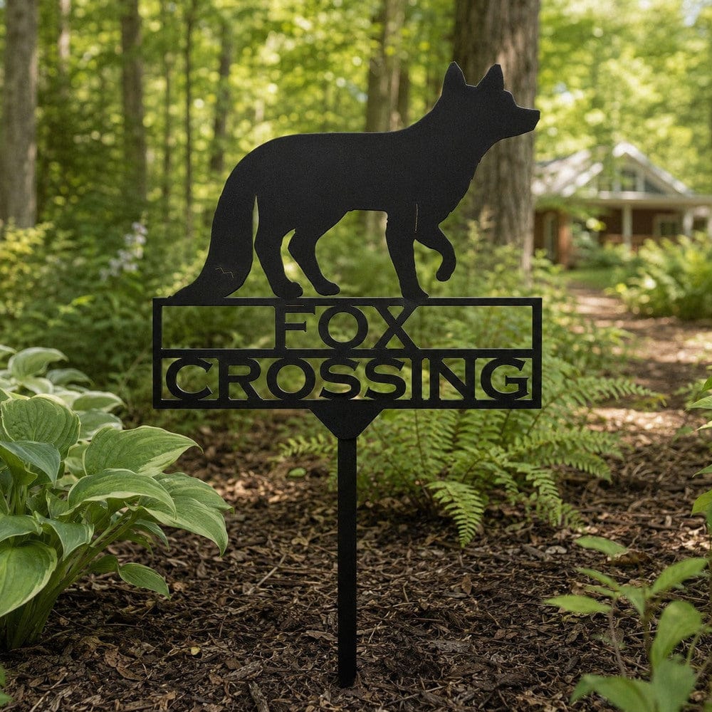 Fox Crossing outdoor metal stake displayed in a rustic country garden