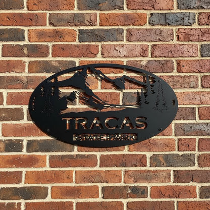 Tracas State Park sign on brick wall