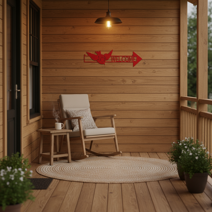 Welcome arrow sign on front porch wall
