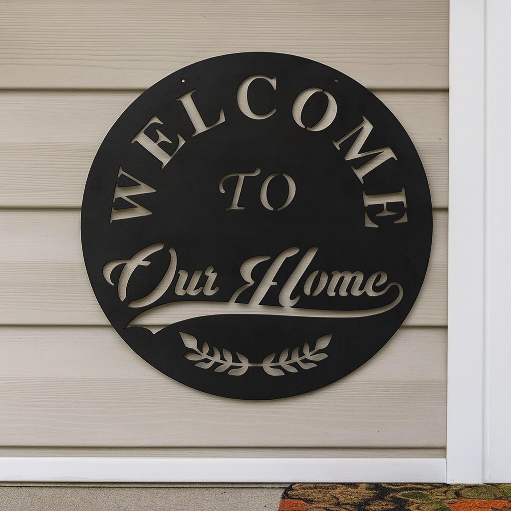 Decorative metal sign with 'Welcome to Our Home' text on a house exterior.