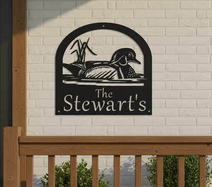 Wood duck sign on front porch wall - zoomed in 10%